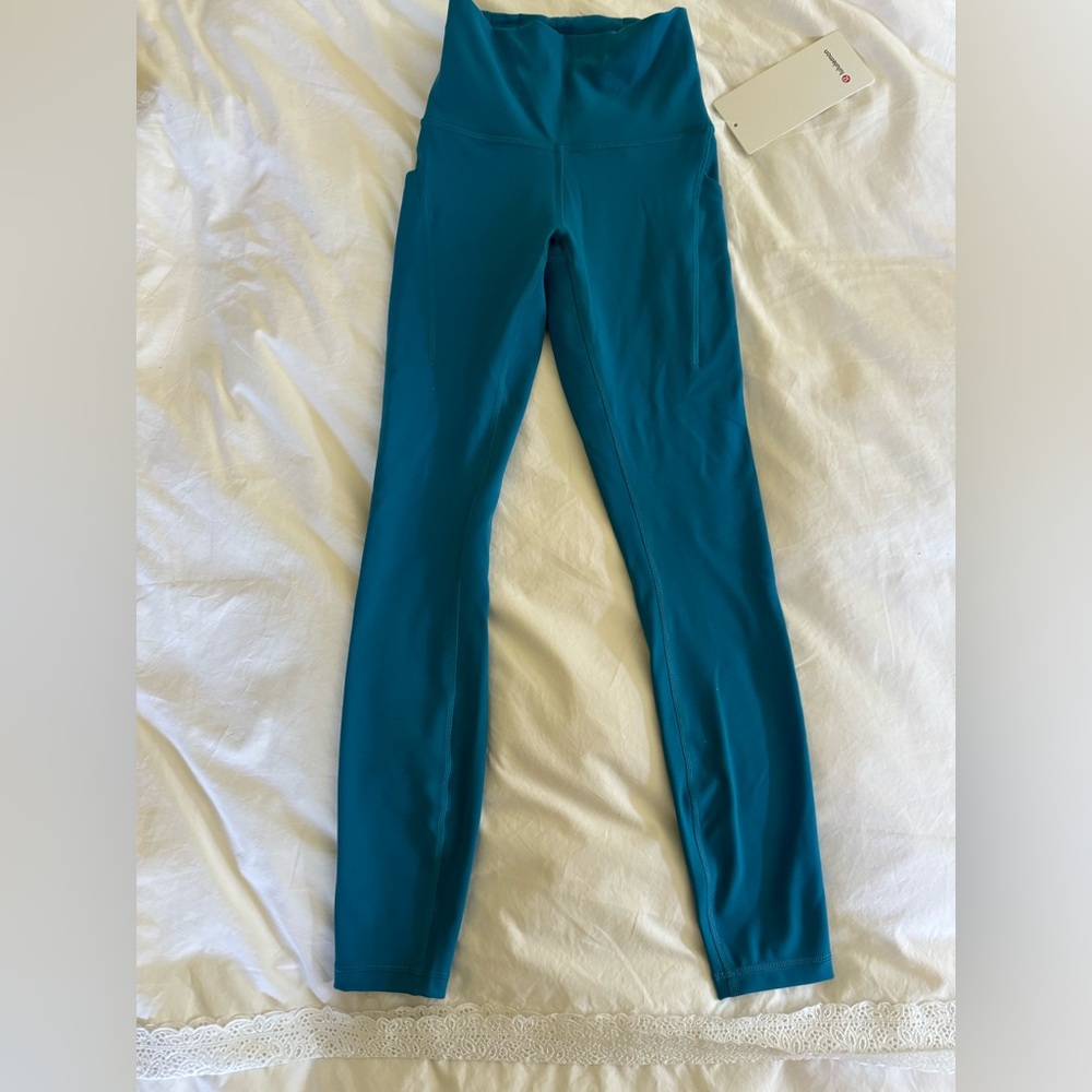 Lululemon never worn Wunder Train HR Tight 25” Pockets
